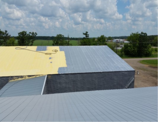 Metal roof coated with an elastomeric polyurea membrane