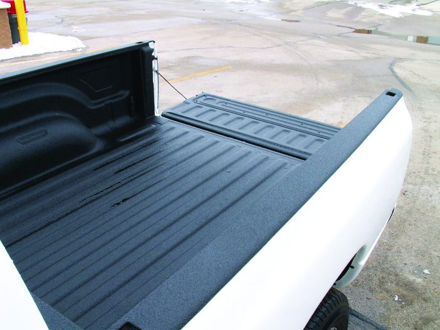Truck bed protected with a thick polyurea film
